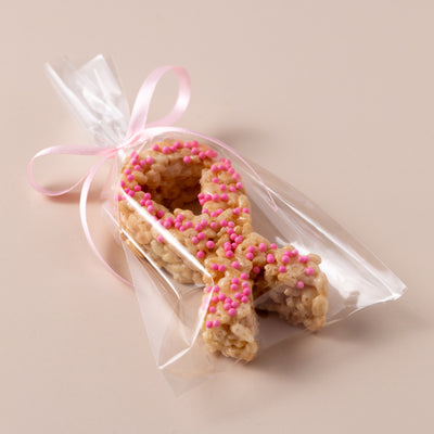 Gourmet rice crispy treat shaped like a breast cancer awareness ribbon